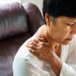 old woman suffering from neck and shoulder injury, health problem concept