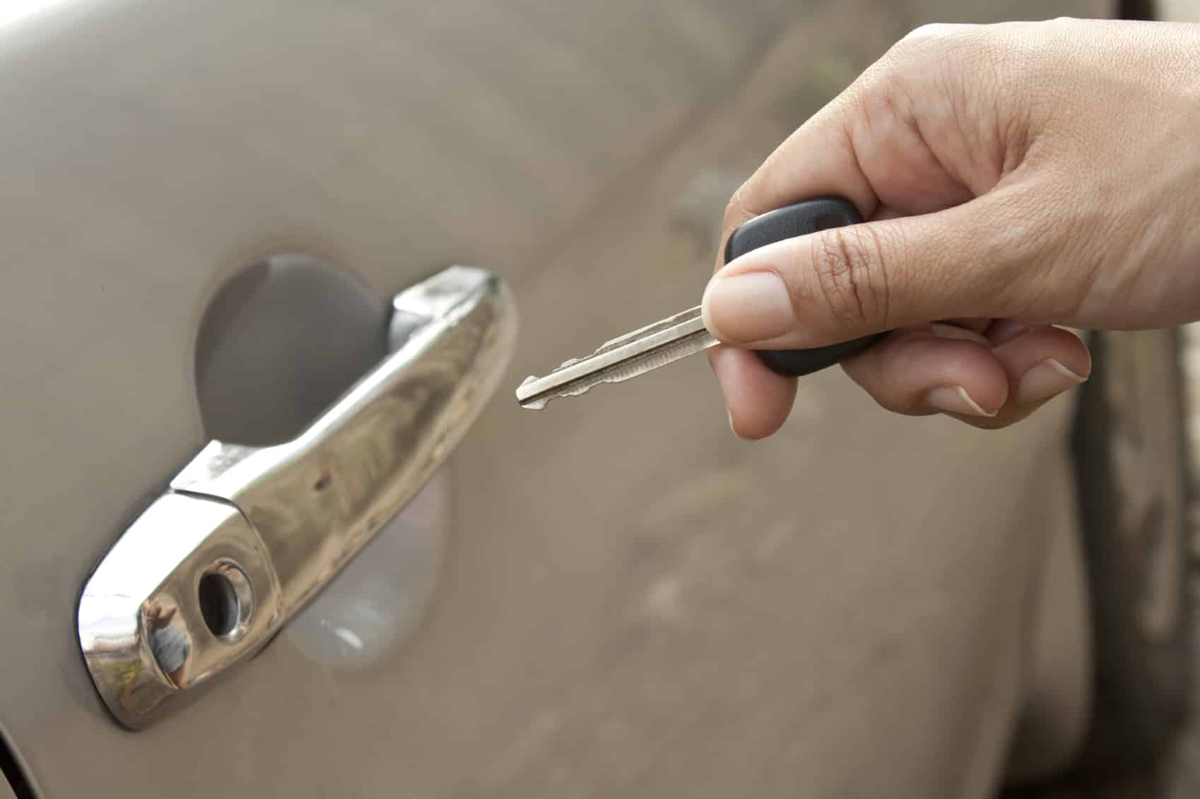 Hand inserting the car's key